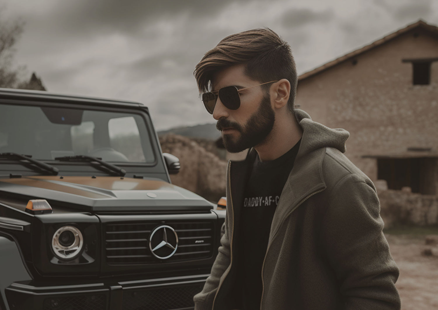 User Handsome male model wearing a black cotton crew-cut DaddyAFCartel t-shirt with a white premium chest name logo, along with classic 80’s vintage black modern aviator sunglasses, outdoors next to a luxury SUV on a Mexican ranch